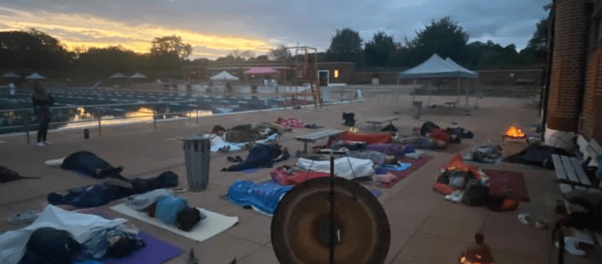 Outdoor lido gong bath at dusk