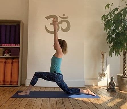 Low lunge yoga pose in the studio