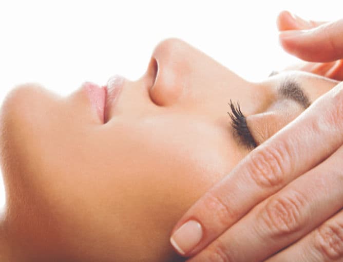 A facial reflexology treatment in progress