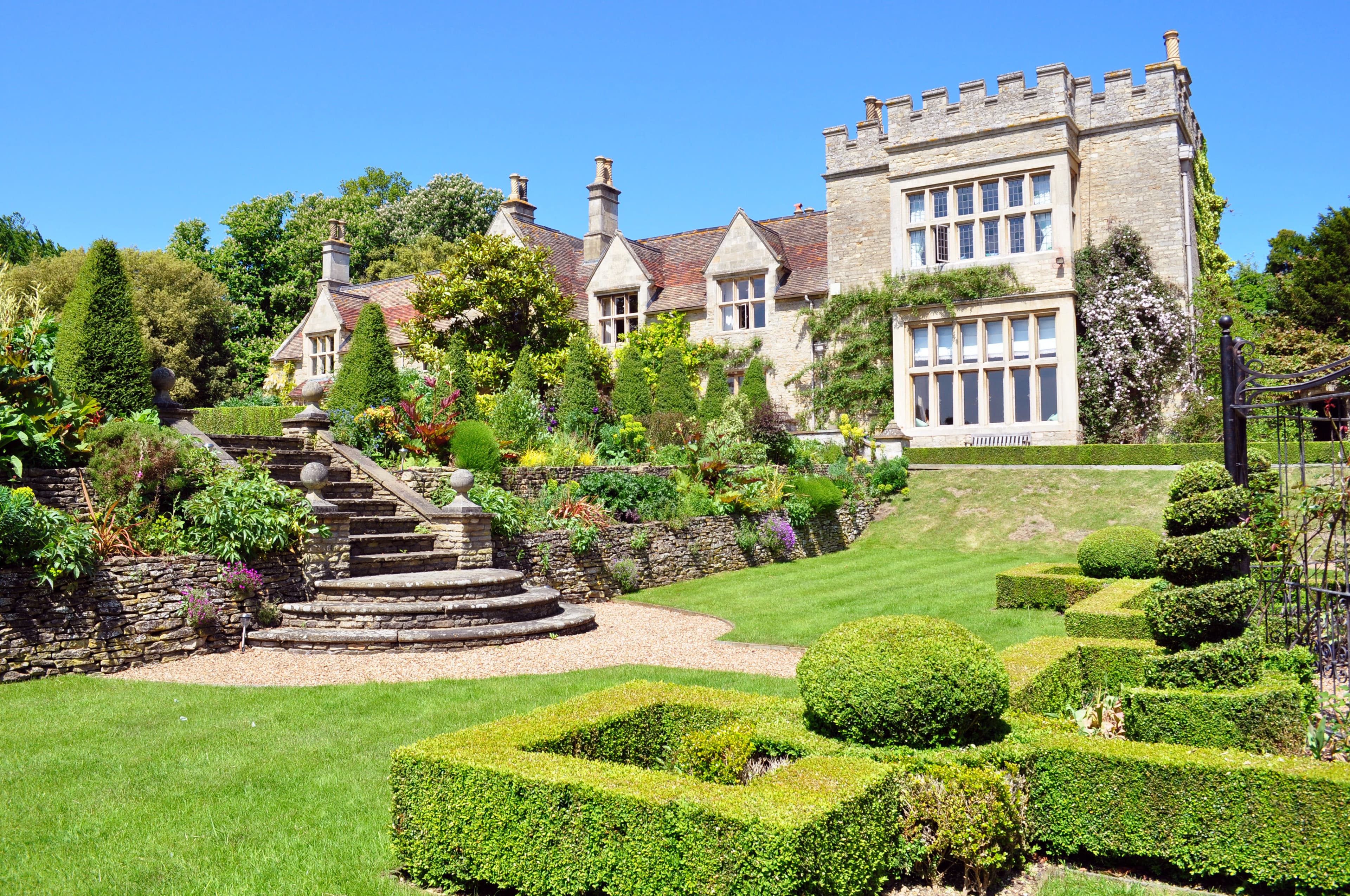 Tofte Manor and its terraced gardens on a clear day